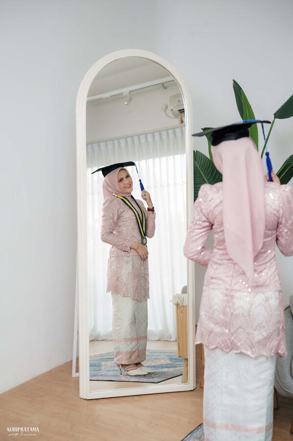 Raudhatul Graduation Portait with Adbi Pratama Photo